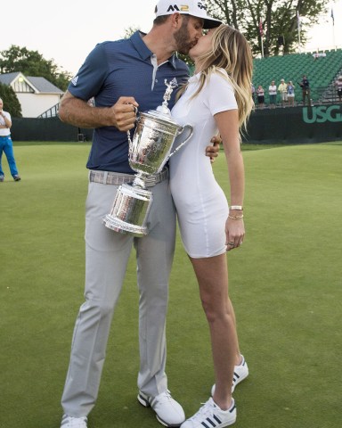 Dustin Johnson kisses Paulina Gretzky when holds the Championship Trophy on the 18th green after winning his first major championship in the final round at the U.S. Open at Oakmont Country Club near Pittsburgh, Pennsylvania on June 19, 2016. Johnson won with a score of 5 under par.
U.s. Open Golf 2016, Oakmont, Pennsylvania, United States - 19 Jun 2016