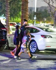 EXCLUSIVE: Kim Kardashian was seen leaving Dave & Buster's with North West and Saint West. Kim cut a low key outfit sporting black and checkered vans slip ons. 28 Nov 2021 Pictured: Kim Kardashian. Photo credit: PG/MEGA TheMegaAgency.com +1 888 505 6342 (Mega Agency TagID: MEGA809297_001.jpg) [Photo via Mega Agency]