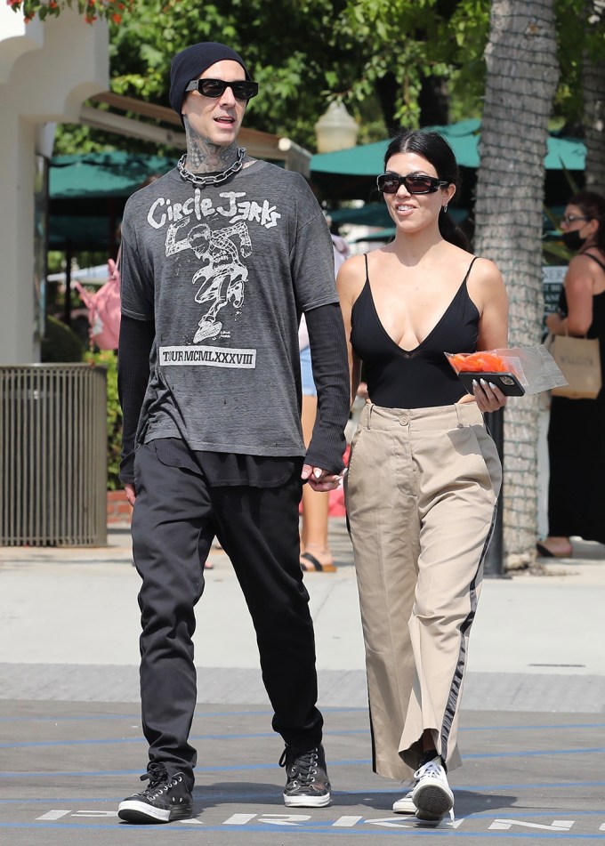 Kourtney Kardashian In A Plunging Top With Travis Barker