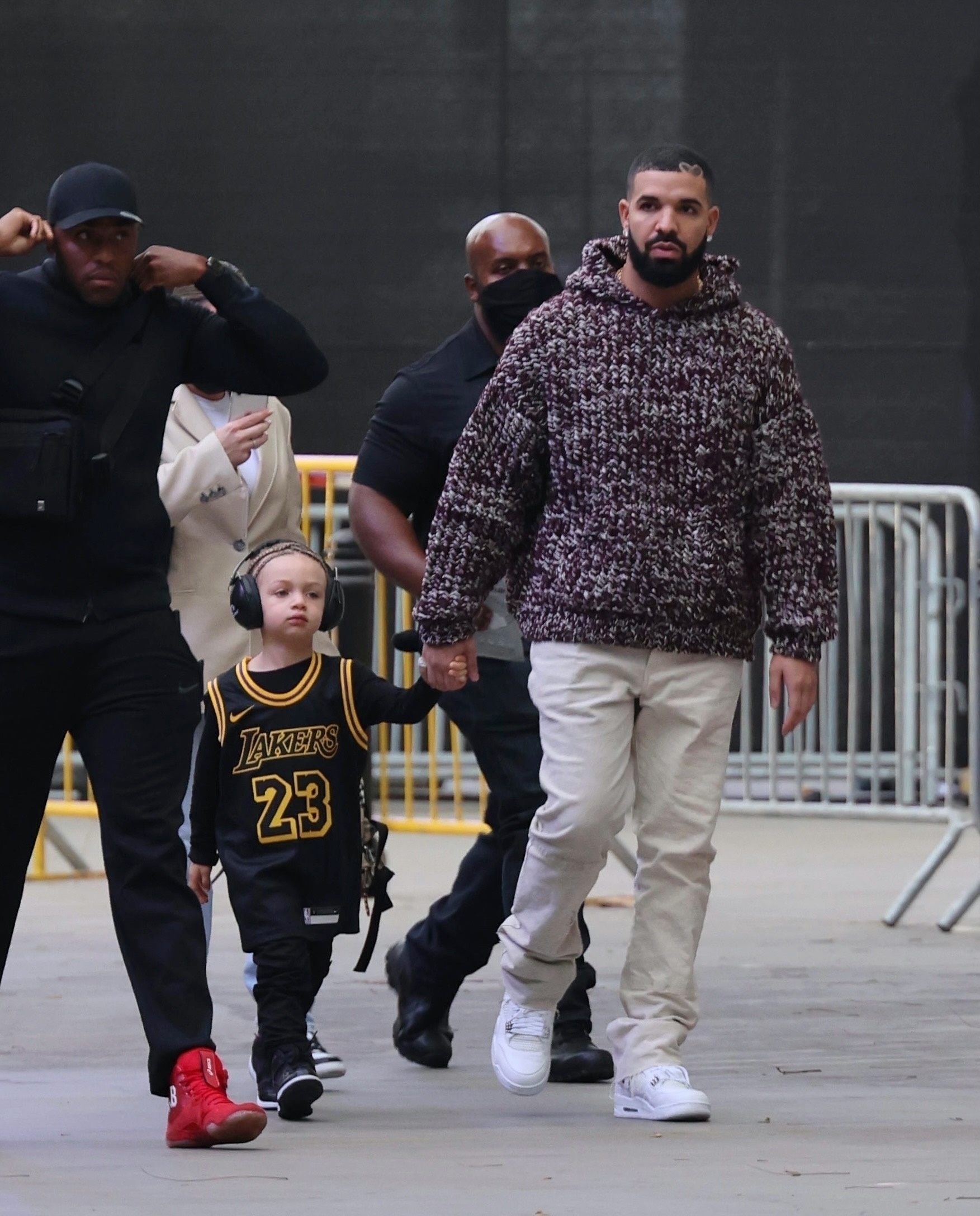 *EXCLUSIVE* Drake arrives holding his son Adonis's hand for the Lakers game