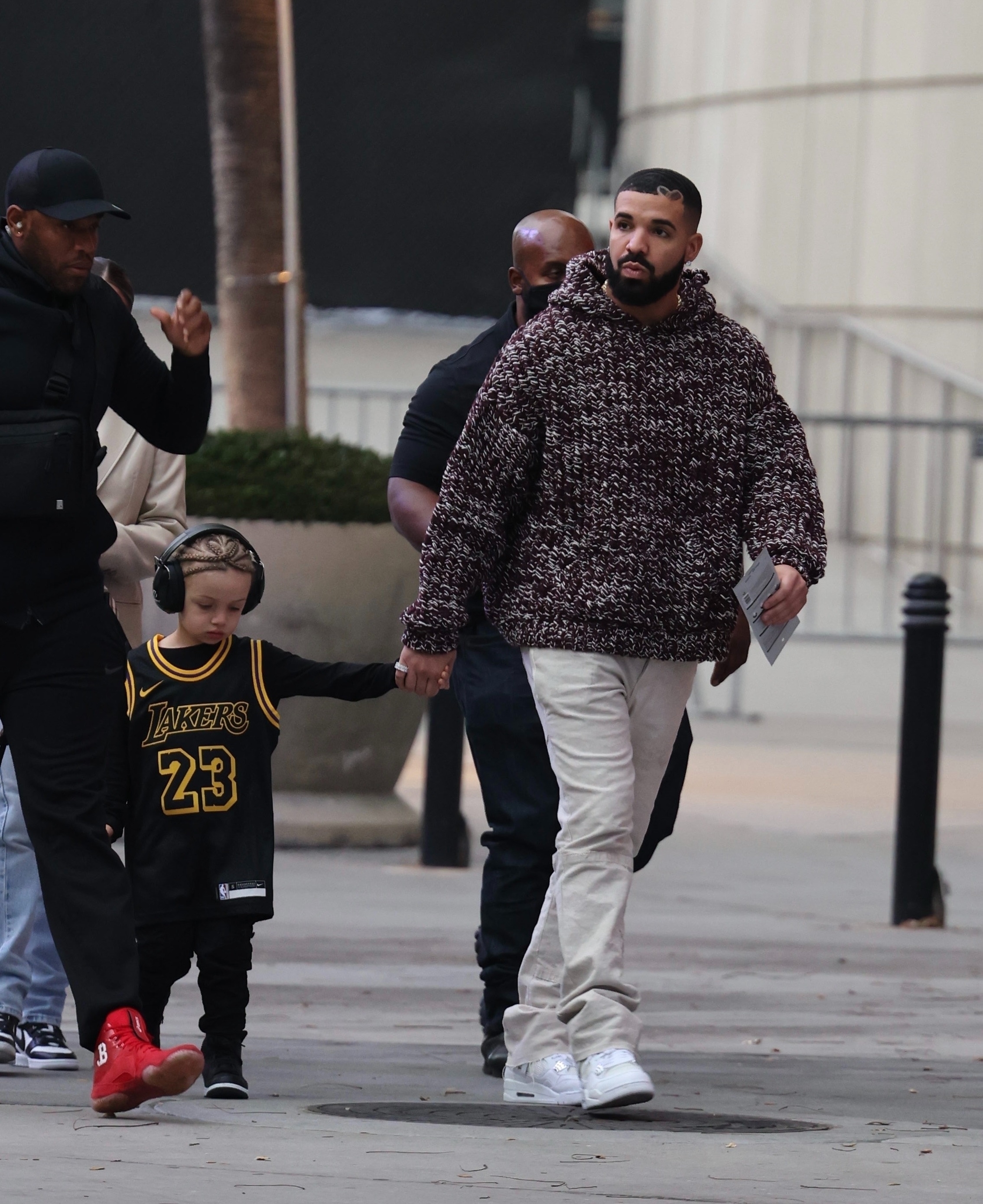 *EXCLUSIVE* Drake arrives holding his son Adonis's hand for the Lakers game