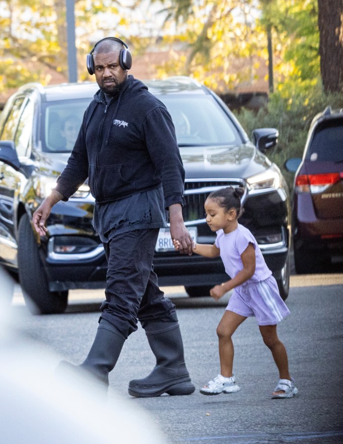 Kanye West & his daughter Chicago at North’s basketball game