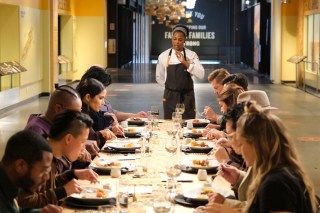 TOP CHEF -- "The Cheesier The Better" Episode 1812 -- Pictured: (l-r) Kwame Onwuachi, Melissa King, Padma Lakshmi, Dawn Burrell, Richard Blais, Gail Simmons, Dale Talde, Brooke Williamson -- (Photo by: David Moir/Bravo)