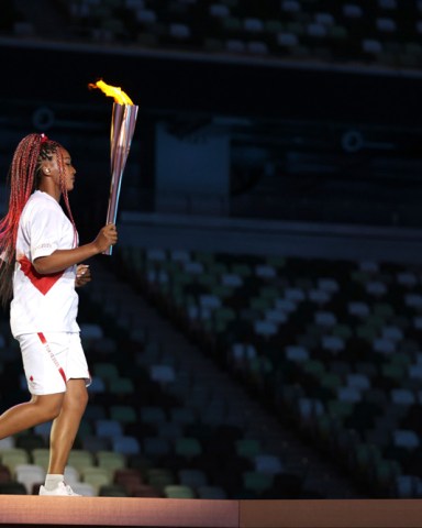 Naomi Osaka carries the Olympic Torch during the opening ceremony in the Olympic Stadium at the 2020 Summer Olympics, in Tokyo, Japan
Olympics Opening Ceremony, Tokyo, Japan - 23 Jul 2021