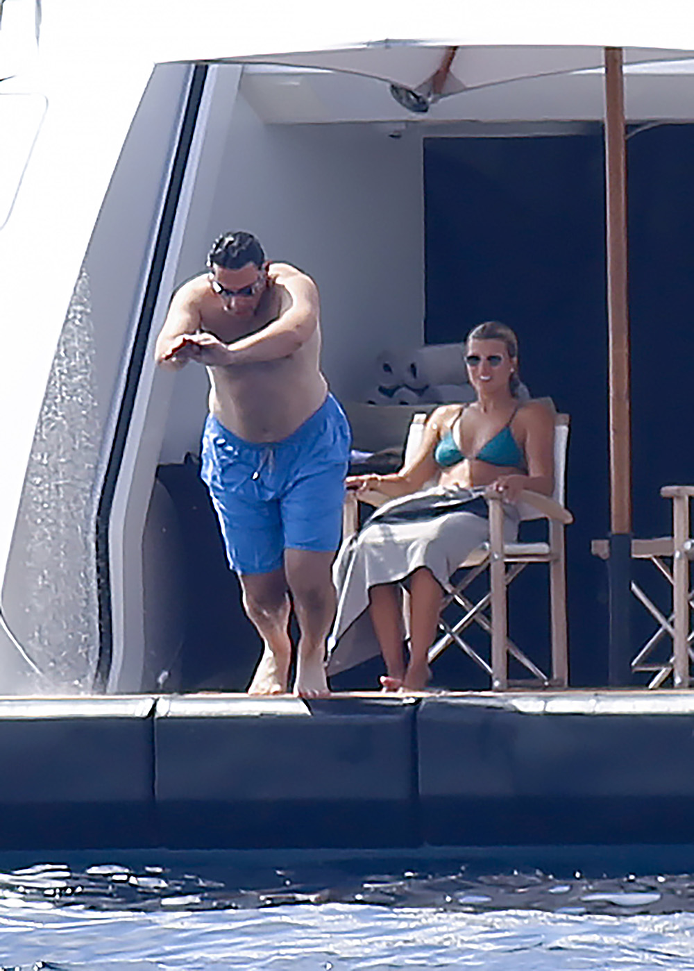 EXCLUSIVE: Sofia Richie in a green bikini and her fiance Elliot Grainge enjoy a swim in the sea aboard a yacht in Ibiza on July 25, 2022 in Ibiza, Spain. 25 Jul 2022 Pictured: Sofia Richie and Elliot Grainge. Photo credit: Elkin Cabarcas / MEGA TheMegaAgency.com +1 888 505 6342 (Mega Agency TagID: MEGA881216_032.jpg) [Photo via Mega Agency]