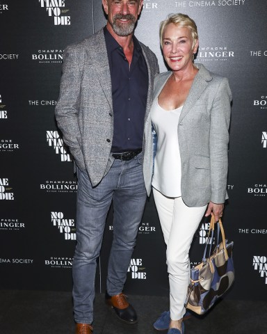 Actor Christopher Meloni, left, and his wife Sherman Williams, right, attend a special screening of "No Time to Die" hosted by Champagne Bollinger and The Cinema Society at iPic Theater, in New York
NY Special Screening of "No Time to Die", New York, United States - 07 Oct 2021