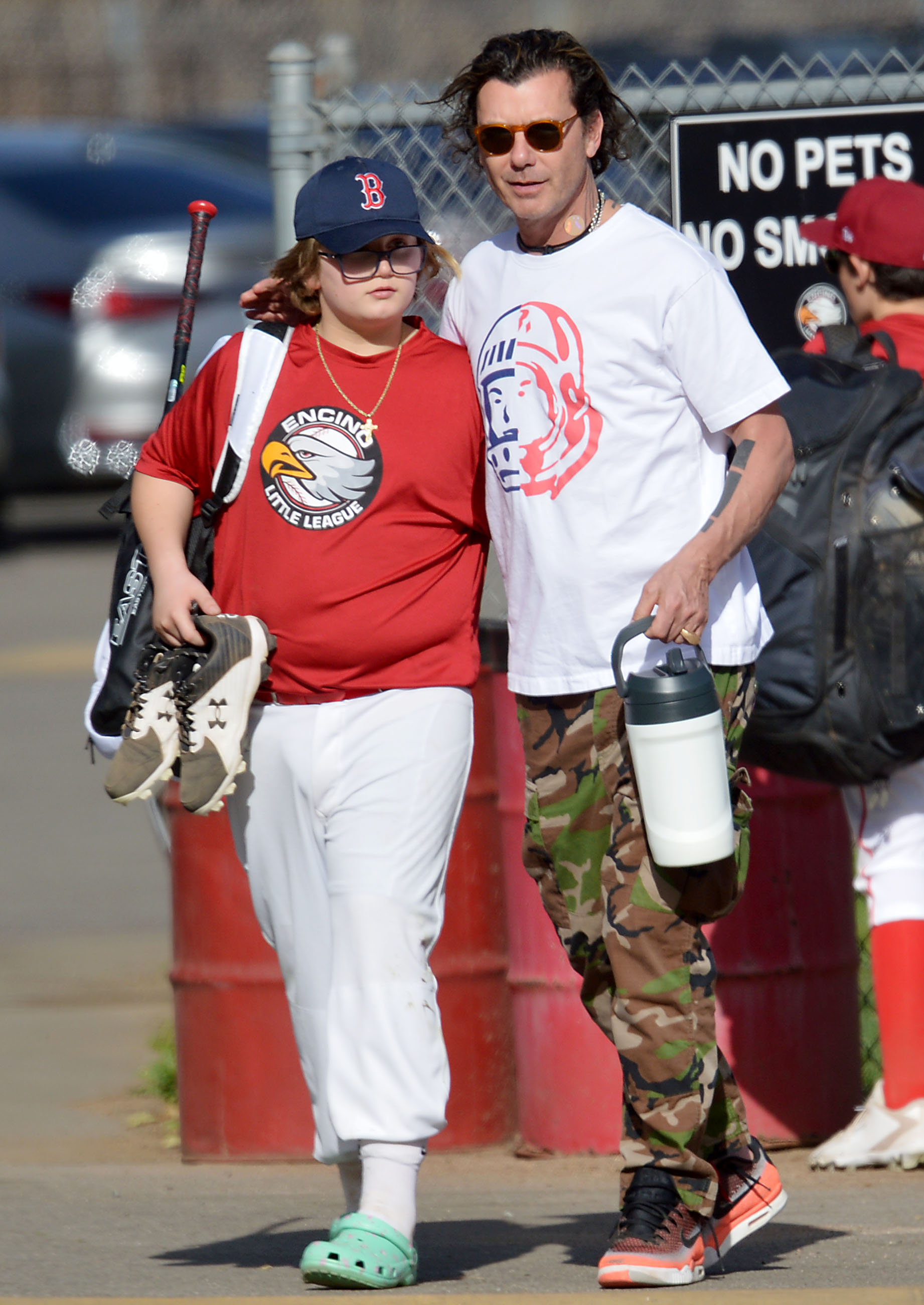 EXCLUSIVE: Gavin Rossdale puts his arm around his son Zuma after baseball practice