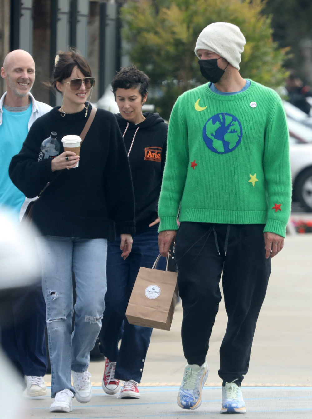 *EXCLUSIVE* Chris Martin and Dakota Johnson look happy after grabbing coffee and candy at SweetBu candy store