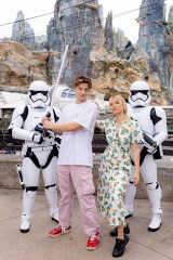 Actors Millie Bobby Brown and Jake Bongiovi joined the Dark Side at Walt Disney World Resort in Lake Buena Vista, Fla. on September 27, 2022. The couple posed with First Order Stormtroopers and Darth Vader's lightsaber at Star Wars: Galaxy's Edge at Disney's Hollywood Studios. Bongiovi said he is a big Star Wars fan and Brown said her favorite character is Princess Leia.
Millie Bobby Brown and Jake Bongiovi at Star Wars: Galaxy's Edge at Disney's Hollywood Studios, Florida, USA - 27 Sep 2022