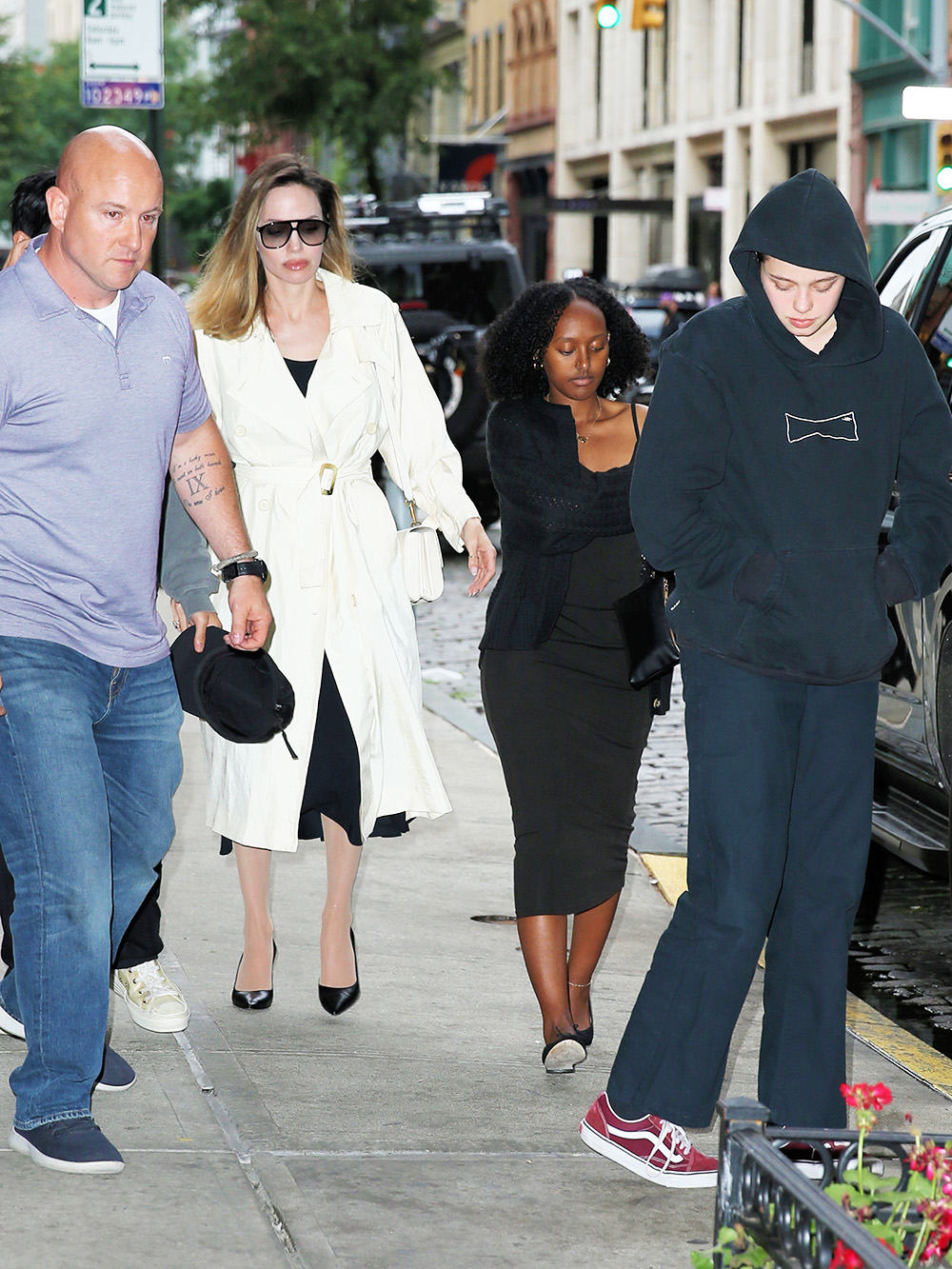 Angelina Jolie Wears A White Trench Coat And Valentino Bag On Her Way To Bond St Sushi Restaurant With Three Of Her Children In New York City