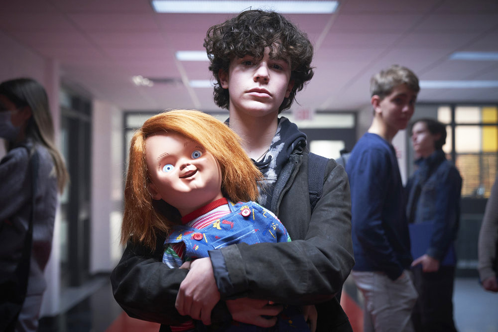 CHUCKY -- "Death by Misadventure" Episode 101 -- Pictured: (l-r) Chucky, Zackary Arthur as Jake Wheeler -- (Photo by: Steve Wilkie/USA Network)