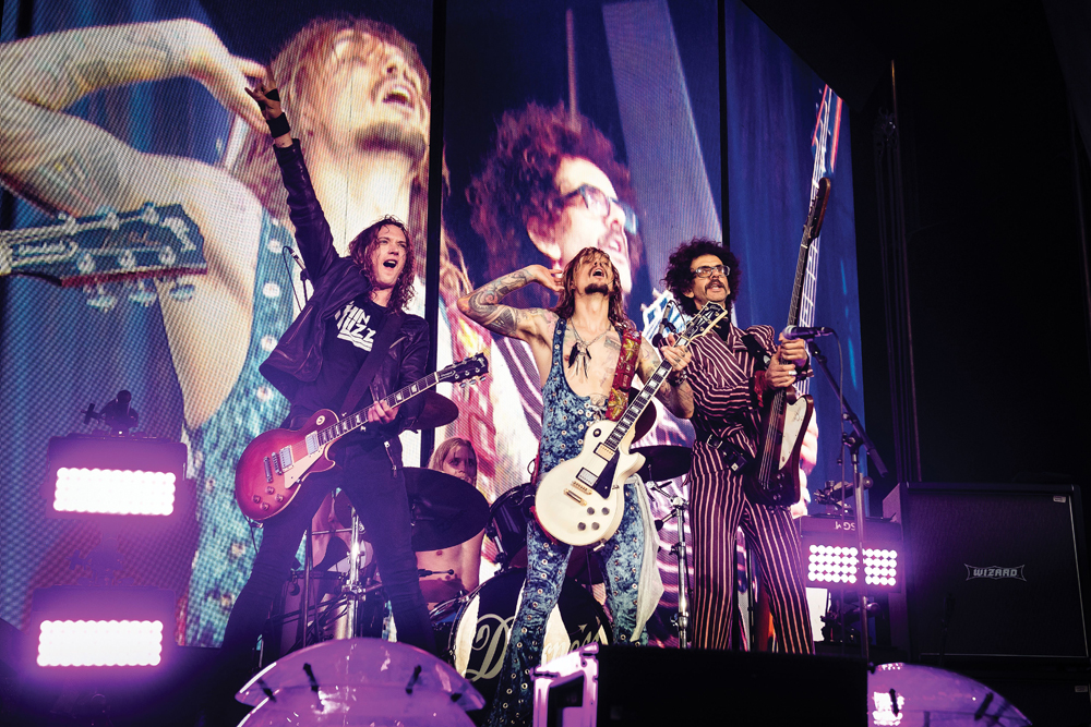 Editorial Use OnlyMandatory Credit: Photo by Classic Rock Magazine/Future/Shutterstock (10719404d)(L-R) Dan Hawkins, Rufus Taylor, Justin Hawkins and Frankie Poullain of British rock group The Darkness performing live on stage at Chantry Park in Ipswich on August 23, 2019The Darkness Portrait & Live Shoot, Ipswich, UK - 23 Aug 2019