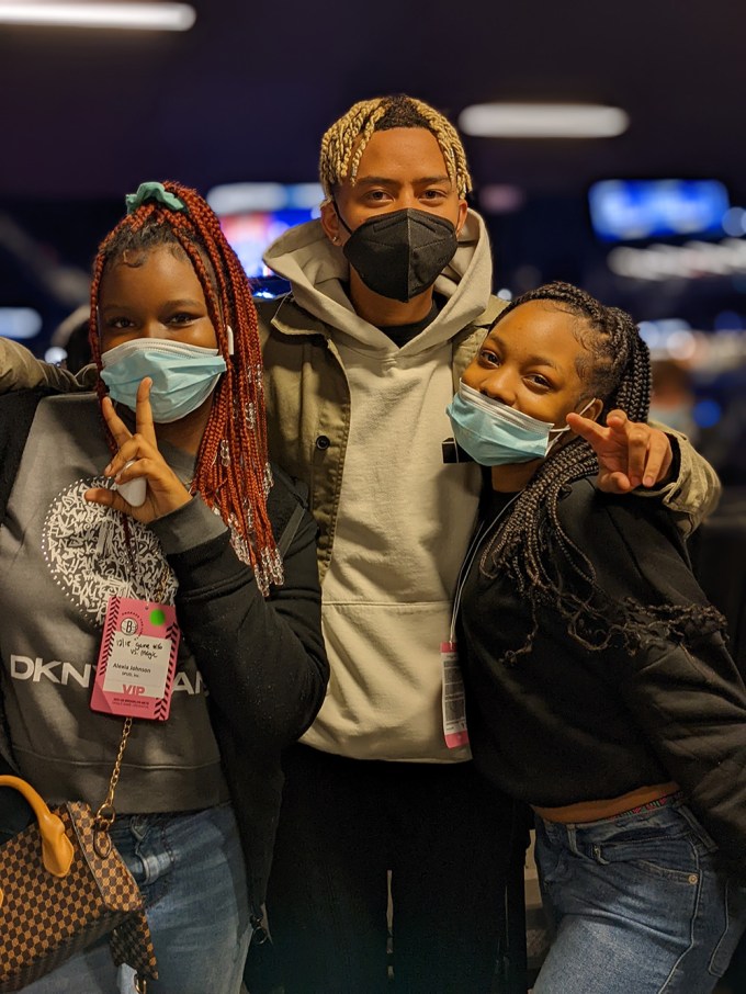 Cordae surprises child recipients at Fanatics store