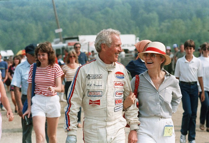 Paul Newman Smiles Besides Joanne Woodward After a Race