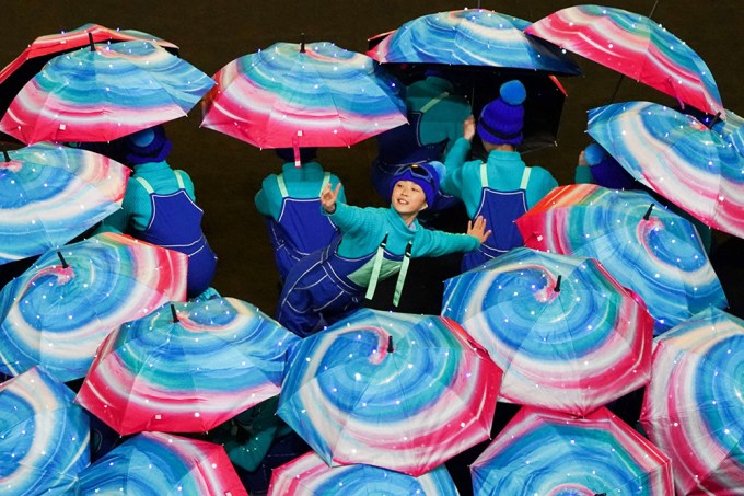 Dancers Performing With Umbrellas At Opening Ceremony