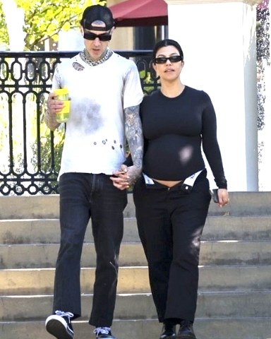 Los Angeles, CA - *EXCLUSIVE* - Kourtney Kardashian confidently shows off her baby bump while holding hands with Travis Barker as they go for a coffee run near their Calabasas home. Travis exudes a cool vibe, while Kourtney rocks a stylish all-black outfit and completes her look with sunglasses. Pictured: Kourtney Kardashian,Travis Barker BACKGRID USA 20 JULY 2023 USA: +1 310 798 9111 / usasales@backgrid.com UK: +44 208 344 2007 / uksales@backgrid.com *UK Clients - Pictures Containing Children Please Pixelate Face Prior To Publication*