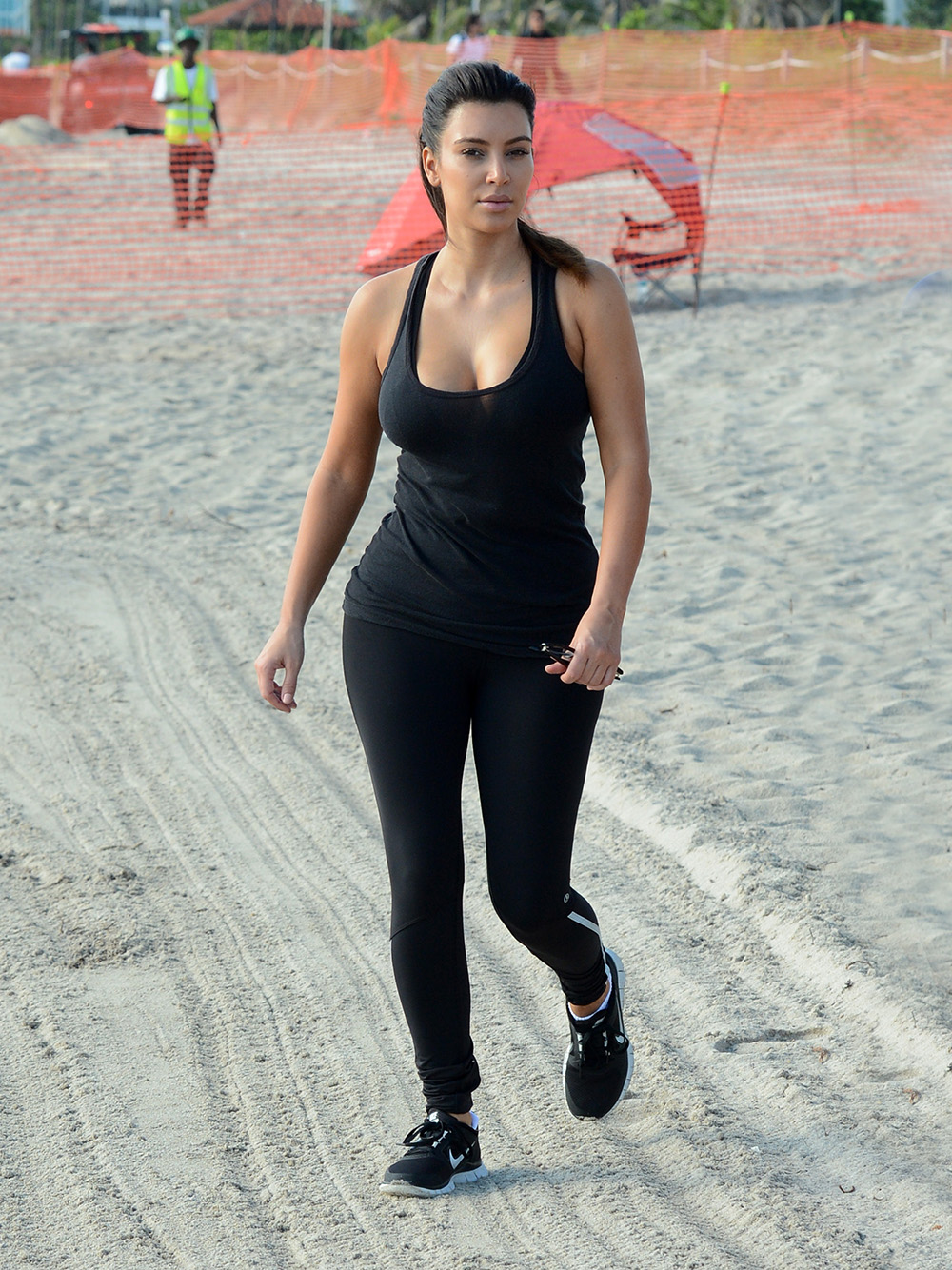 INF - Kim Kardashian Works Out On The Beach In Black Spandex And Hipster Glasses