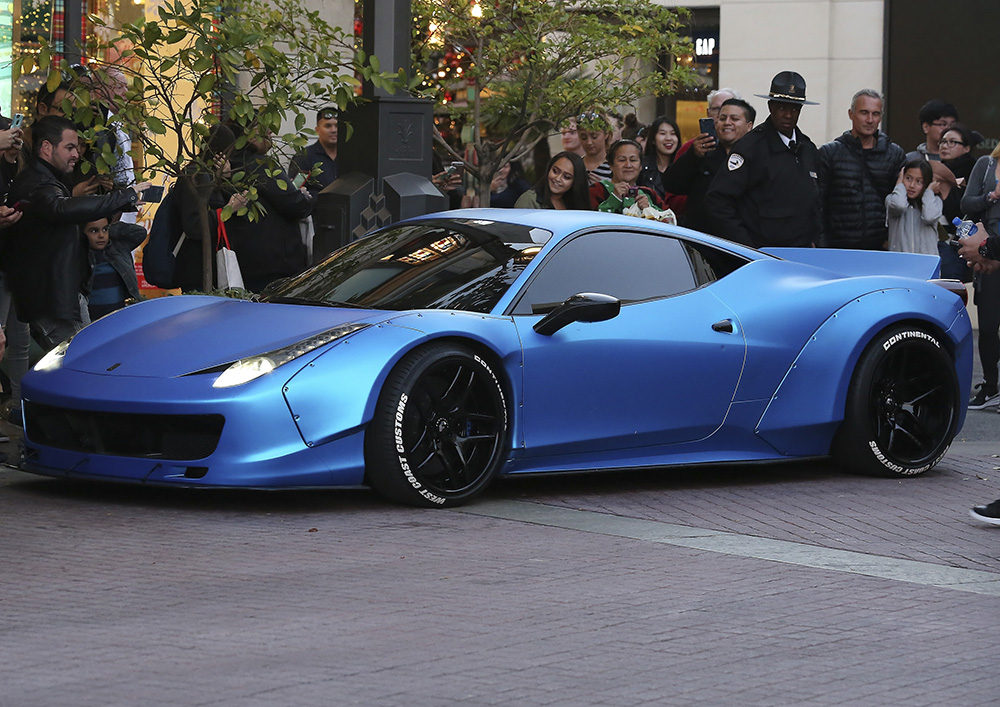 Justin Bieber leaves The Grove in his Ferrari in West Hollywood, California