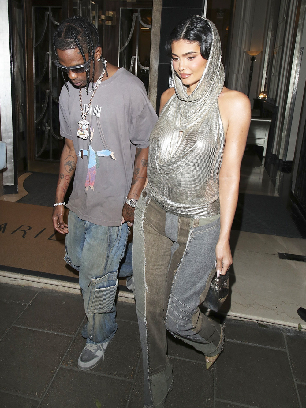 Kylie Jenner and Travis Scott hold hands leaving their hotel to party in London!