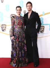 Eddie Redmayne, right, and Hannah Bagshawe pose for photographers upon arrival at the 76th British Academy Film Awards, BAFTA's, in LondonBAFTA Film Awards 2023 Red Carpet, London, United Kingdom - 19 Feb 2023