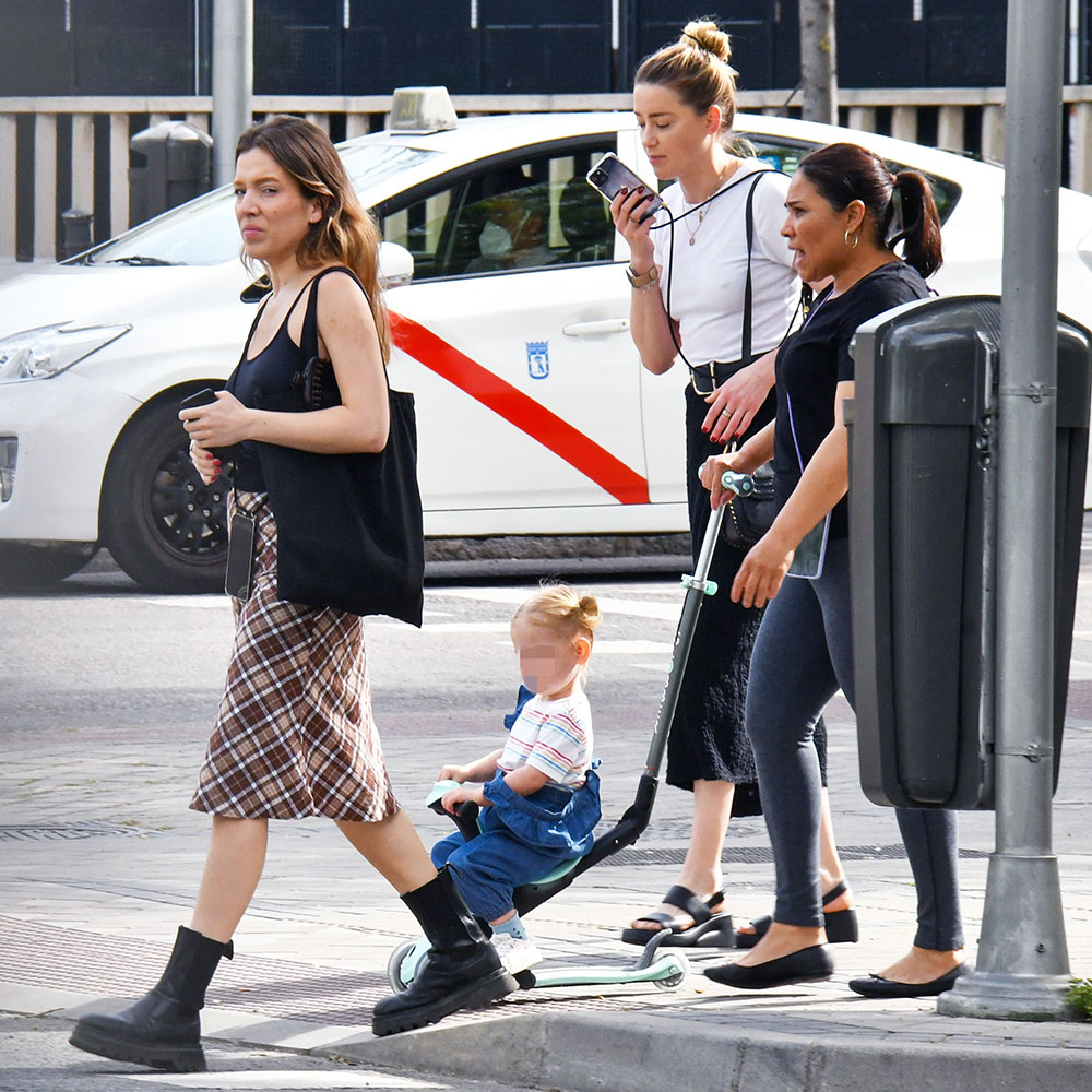 EXCLUSIVE: Amber Heard seen out in Madrid with her daughter after starting a new life in the Spanish capital  after her messy divorce from Johnny Depp