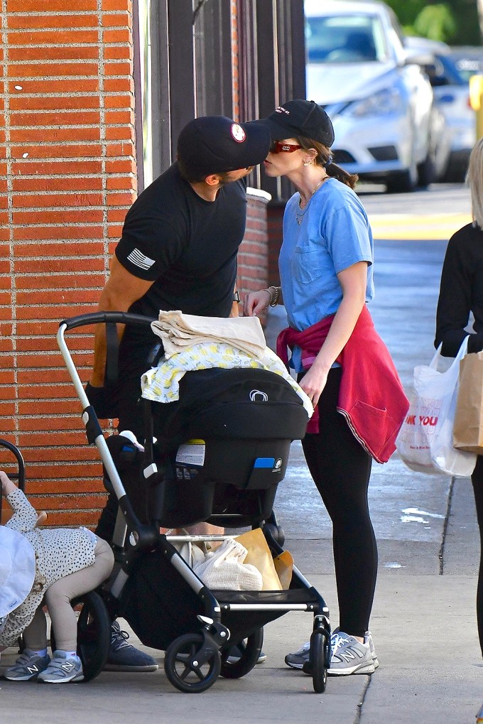 Katherine Schwarzenegger and Chris Pratt share a smooch at the Farmer’s Market