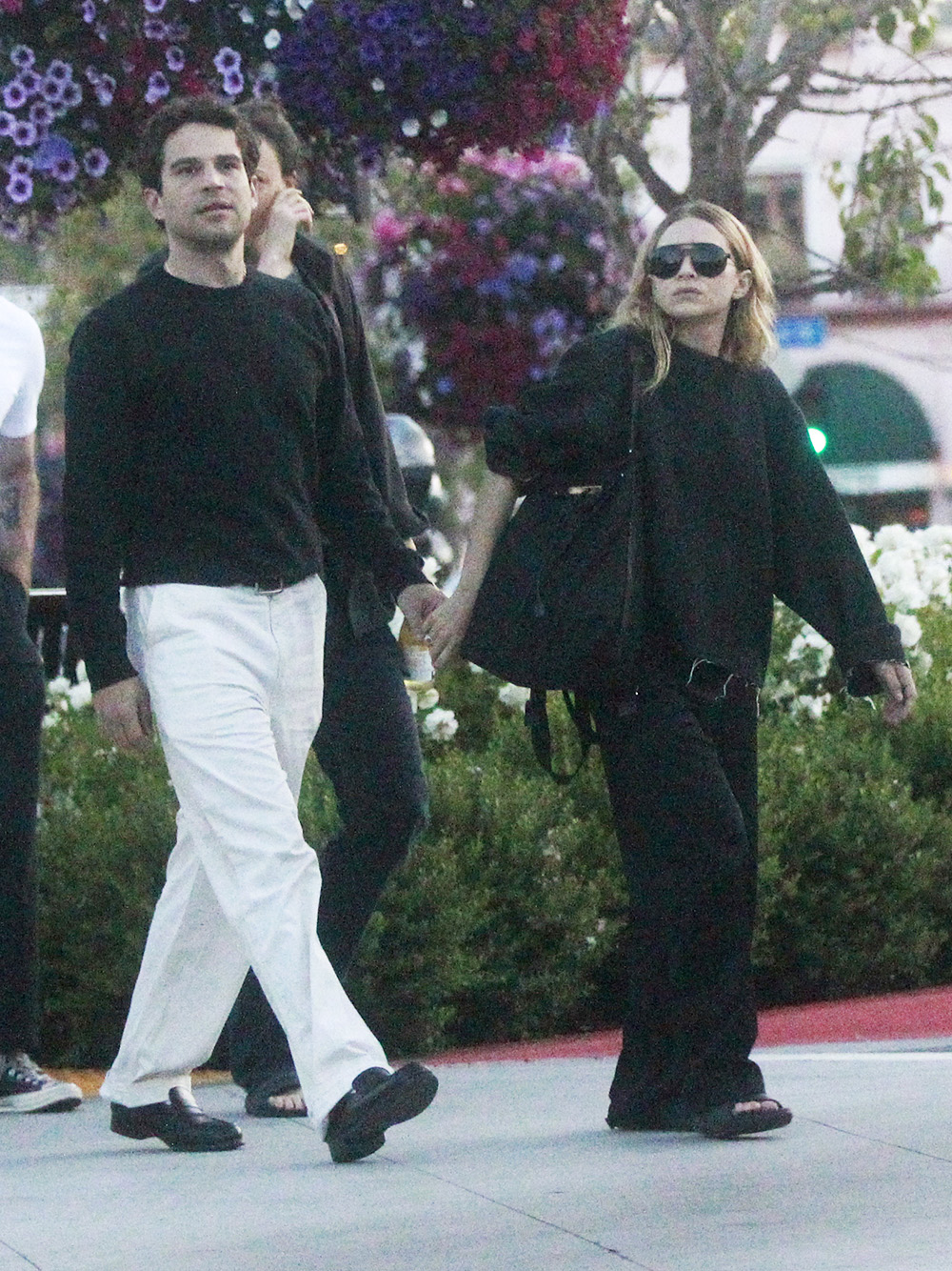 Ashley Olsen shows off a mystery engagement band while out with her Artist boyfriend Louis Eisner