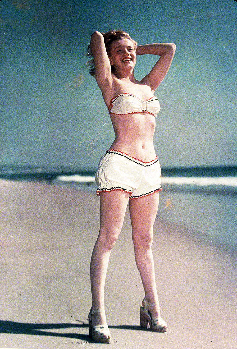 Editorial use only
Mandatory Credit: Photo by Snap/Shutterstock (390853hm)
FILM STILLS OF 1947, BATHING SUIT, BEACH, CLOTHING, MARILYN MONROE, OCEAN, PIN-UPS, BIKINI, TWO PIECE, OUTSIDE, SAND, MIDRIFF, SHOES, FULL LENGTH, ARMS BEHIND HEAD IN 1947
VARIOUS