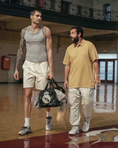 HUSTLE. (L-R) Juancho Hernangomez as Bo Cruz and Adam Sandler as Stanley Sugerman in Hustle. Cr. Cassy Athena/Netflix © 2022.