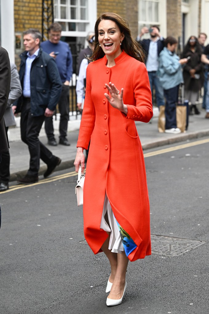 Kate Middleton waves in red