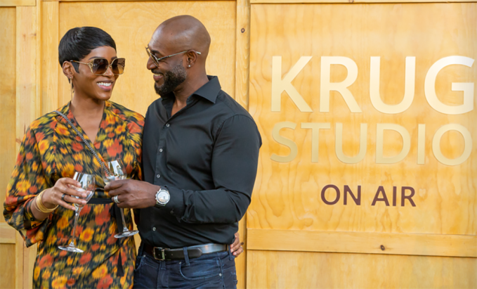 Adrian Holmes & Caroline Chikezie sip a glass of Krug Champagne