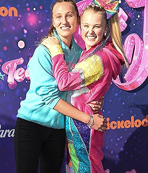 Kylie Prew, left, and JoJo Siwa arrive at the drive-in premiere of JoJo Siwa's "The J Team", at the Rose Bowl in Pasadena, CalifJoJo Siwa's "The J Team" Drive-In Premiere, Pasadena, United States - 03 Sep 2021