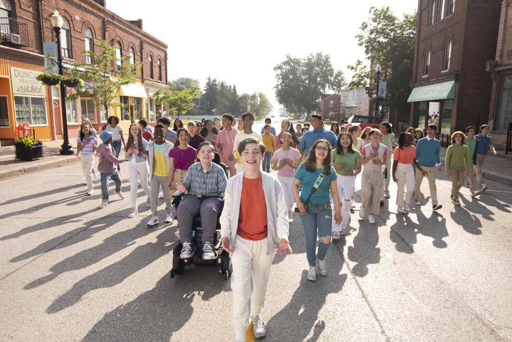 13 The Musical. (L to R) Khiyla Aynne as Charlotte, Ramon Reed as Eddie, Frankie McNellis as Lucy, Nolen Dubuc as Malcolm, Jonathan Lengel as Archie, Liam Wignall as KC, Eli Golden as Evan, JD McCrary as Brett, Lindsey Blackwell as Kendra, Gabriella Uhl as Patrice, Luke Islam as Carlos, Kayleigh Cerezo as Molly, Willow Moss as Zee, Shechinah Mpumlwana as Cassie in 13 The Musical. Cr. Alan Markfield/Netflix © 2022.