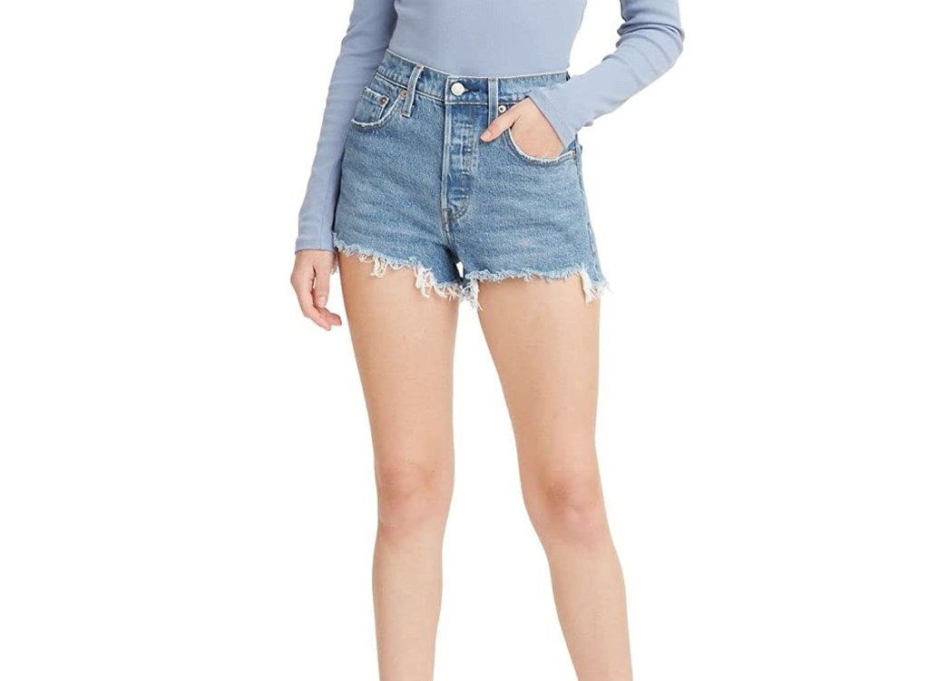 A pair of white denim shorts