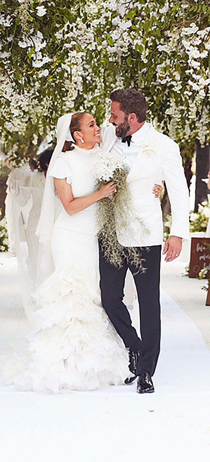 Ben Affleck & Jennifer Lopez smile as they walk down the aisle