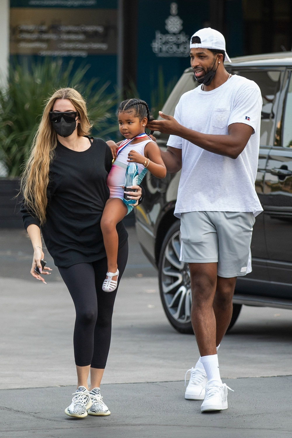 Calabasas, CA  - *EXCLUSIVE*  - Khloe Kardashian and Tristan Thompson were seen meeting up once again to co-parent their adorable daughter True, at dance class. The couple seemed at ease in each other's company after a rocky few months in which Tristan faced new cheating allegations. Khloe dressed casually in black leggings and a black top carried True before Tristan took her and carried her in to the class.

Pictured: Khloe Kardashian, Tristan Thompson, True Thompson

BACKGRID USA 17 AUGUST 2021 

BYLINE MUST READ: IXOLA / BACKGRID

USA: +1 310 798 9111 / usasales@backgrid.com

UK: +44 208 344 2007 / uksales@backgrid.com

*UK Clients - Pictures Containing Children
Please Pixelate Face Prior To Publication*