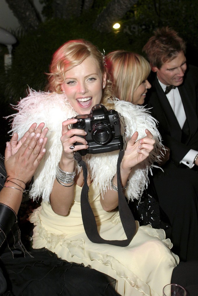 Charlize Theron Is In Feather Heaven At The Golden Globes