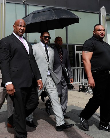 R Kelly. Musician R. Kelly, center, departs from the Leighton Criminal Court building after pleading not guilty to 11 additional sex-related charges, in Chicago
R Kelly, Chicago, USA - 06 Jun 2019