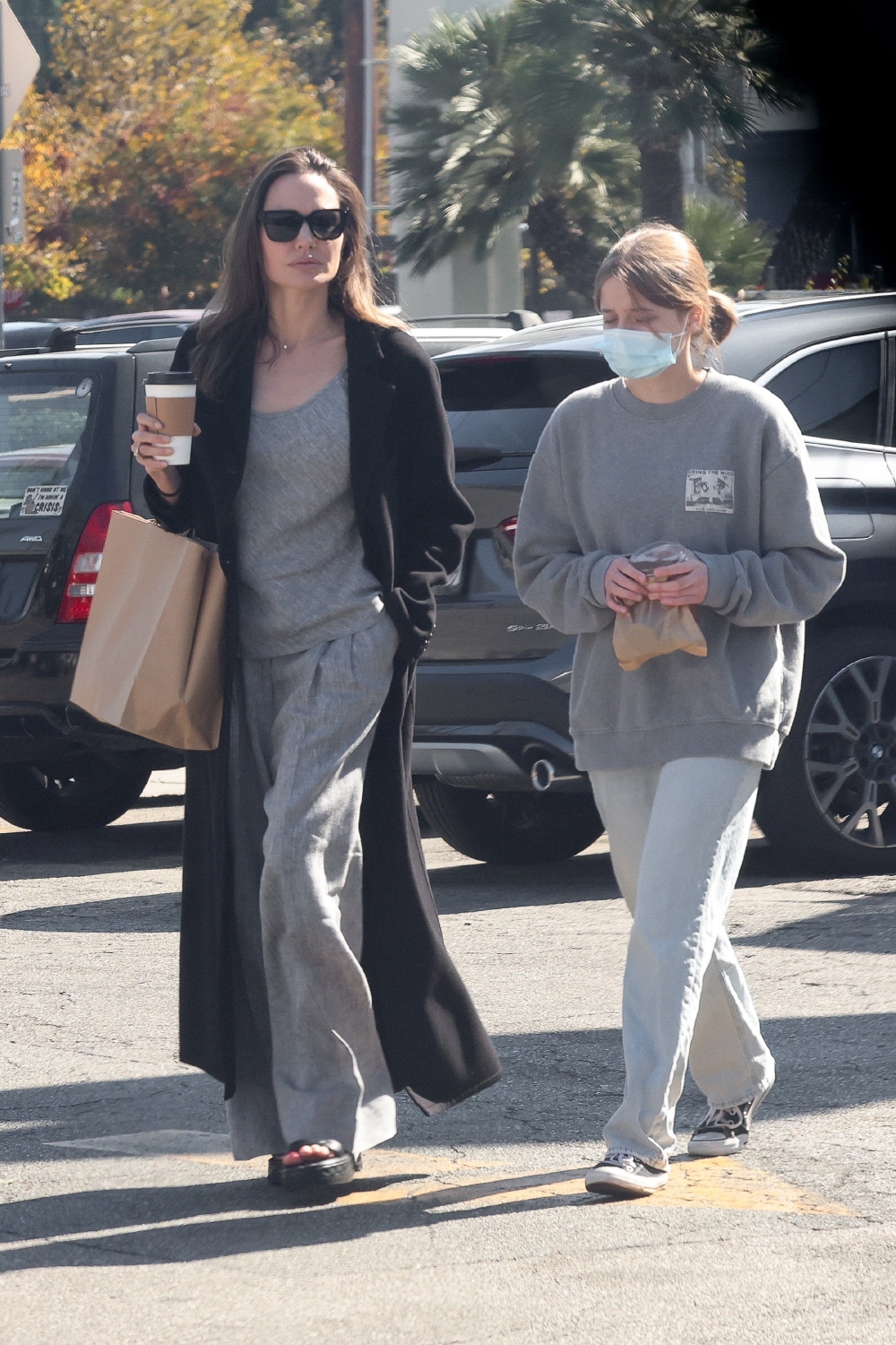 Los Feliz, CA  - *EXCLUSIVE*  - Angelina Jolie looks classy in a long black coat as she goes shopping for groceries with her daughter at Gelson's.

Pictured: Angelina Jolie

BACKGRID USA 29 OCTOBER 2022 

USA: +1 310 798 9111 / usasales@backgrid.com

UK: +44 208 344 2007 / uksales@backgrid.com

*UK Clients - Pictures Containing Children
Please Pixelate Face Prior To Publication*