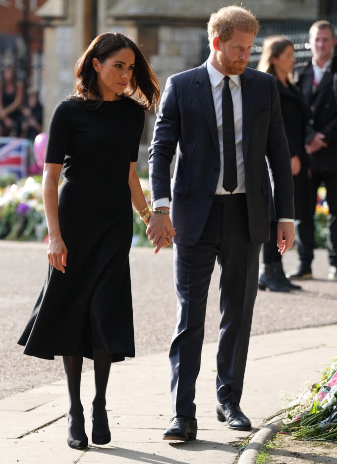 Meghan Markle and Prince Harry hold hands