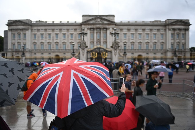 A Tourist Waits Outside The Palace