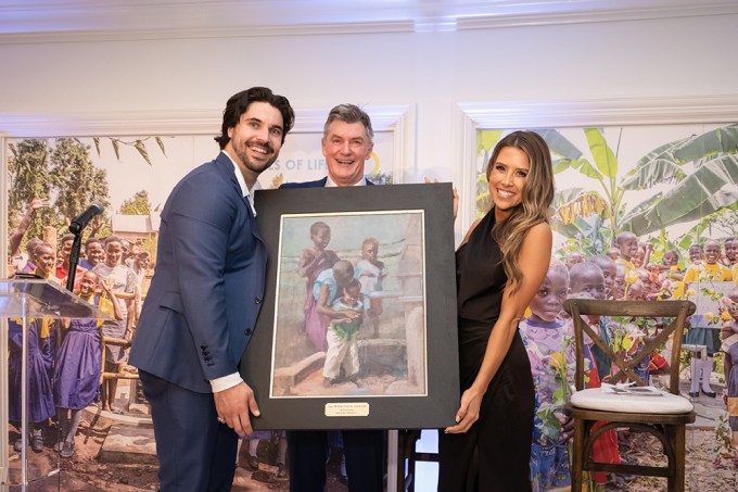 Austin Hedges and his wife Maggie Receiving Original Art Piece
