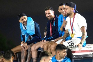 Captain Lionel Messi, send from left, sits with Angel de Maria, second from right, and Nicolas Otamendi, right, atop of a bus driving the players from the Argentine soccer team that won the World Cup after they landed at Ezeiza airport on the outskirts of Buenos Aires, Argentina
Wcup Soccer, Buenos Aires, Argentina - 20 Dec 2022