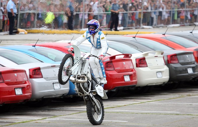 Robbie Knievel Rides His Motorbike While Standing On It