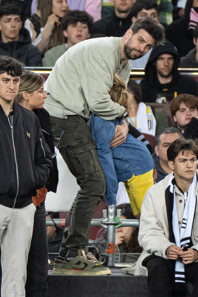 Gerard Pique hugs his son Sasha.