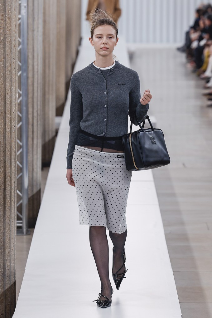 Mia Goth Walks Miu Miu