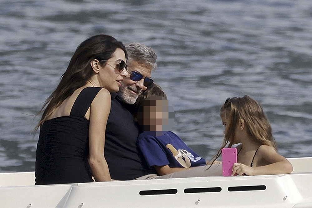 George Clooney and Amal Clooney, accompanied by their sleepy kids Ella and Alexander, embark on a picturesque boat trip in Como