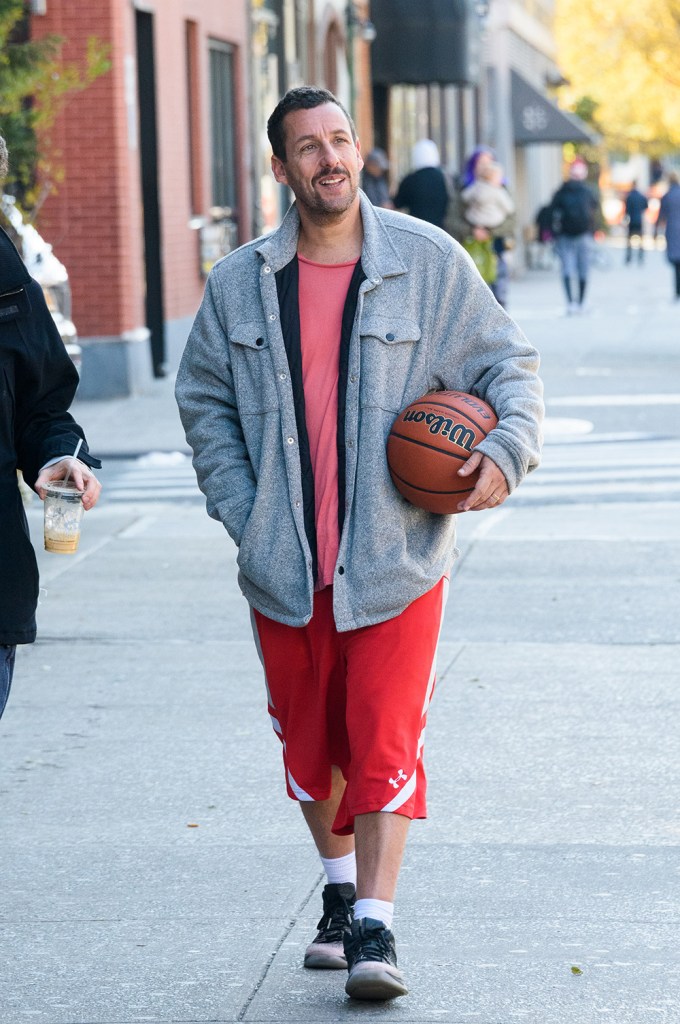 Adam Sandler smiles in the East Village