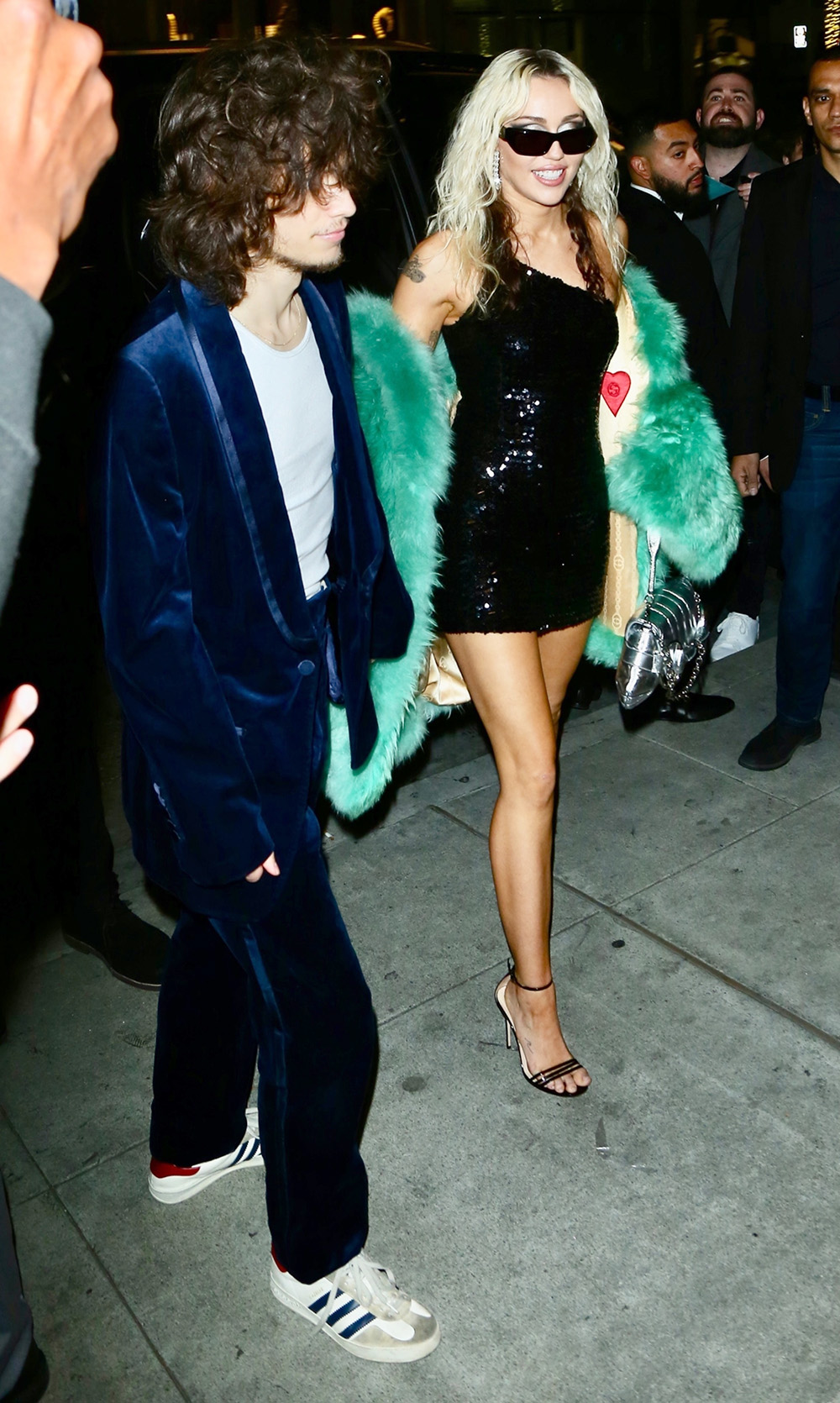 Miley Cyrus and her boyfriend arrive at Gucci in Beverly Hills for launch of her album