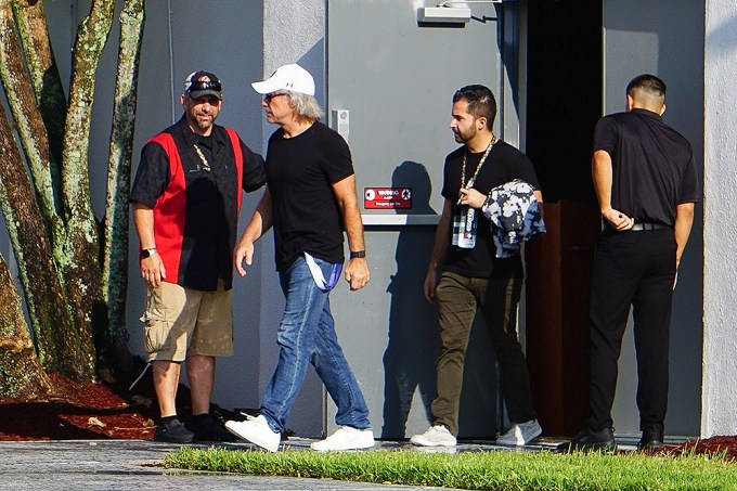 Jon Bon Jovi walks away from the building